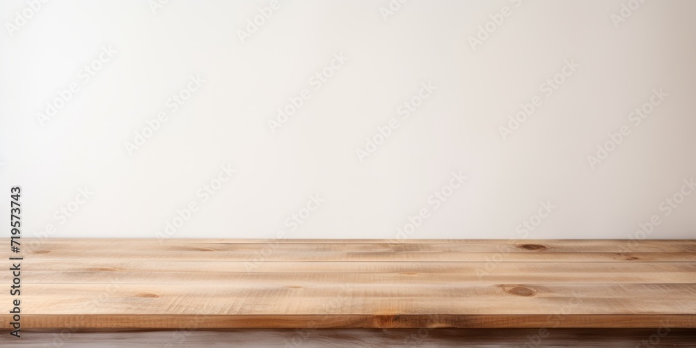 Empty wooden beige table over white wall background