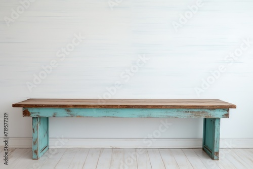 Empty wooden cyan table over white wall background