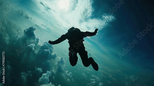 Skydiving Stunt Silhouette. The Grace of a Skydiver's Dance in the Clutches of Gravity. Freefall Fantasy photo