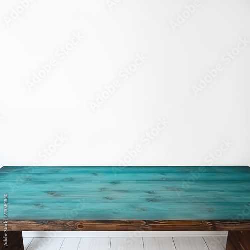 Empty wooden teal table over white wall background