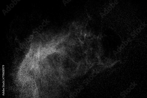 Smoke cloud. Abstract splashes of water on black background. White explosion. Light overlay texture. 