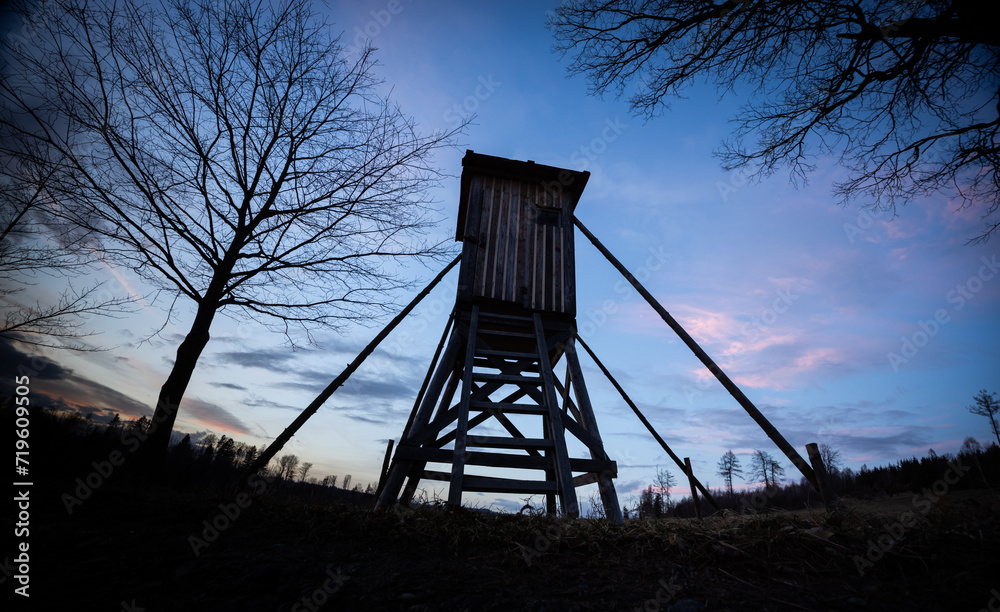 Wooden hunting tower silhouette with night sky on background Wooden hunting tower silhouette with night sky on background