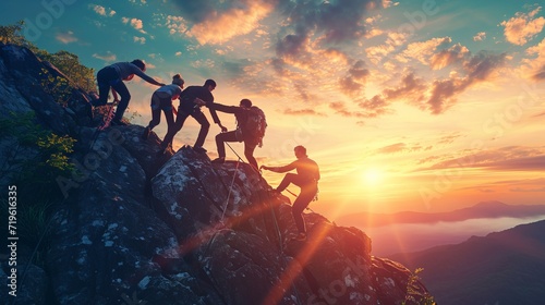 Group of friends climbing together, helping each other reach the mountain peak as a team