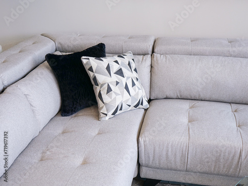 new bed with pillows grey modern couch with triangle shaped cushions stylish pillow sectional sofa in a furniture store home style new decor 