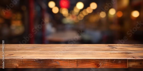 Product display on empty wooden table or counter in a cafeteria, bar, or coffeeshop backdrop. photo