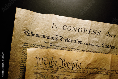 Pages of the United States Constitution showing We The People heading and Declaration of Independence photo