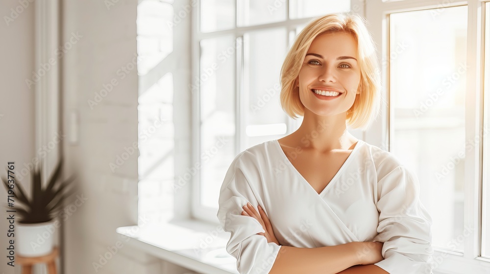 Confident and handsome woman portrait on bright defocused interior background with copy space Confident and handsome woman portrait on bright defocused interior background with copy space
