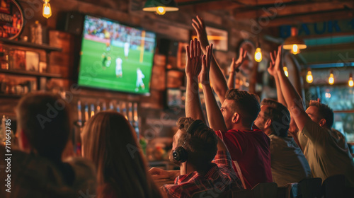 Vibrant sports bar atmosphere where patrons are energetically celebrating photo