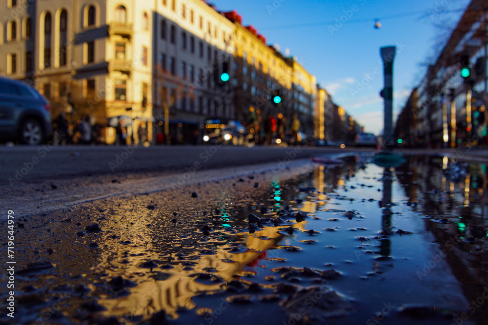 Close-up of wet street in city during rainy season