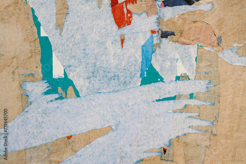 Paper background scraps of red and blue paper, shreds of torn billboard