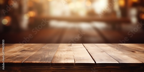 Empty wooden table with blurred background, ideal for restaurant displays or product montages.