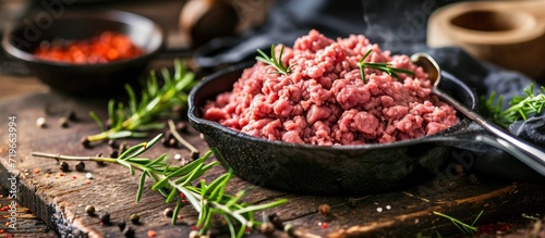 spoonful of freshly cooked ground beef from iron skillet. Copy space image. Place for adding text