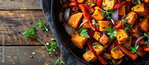 Sweet Potato Hash with Fresh Herbs Peppers and Onions. Copy space image. Place for adding text