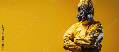 Worker wears medical protective suit or white coverall suit with mask and goggles arm crossed. Copy space image. Place for adding text photo