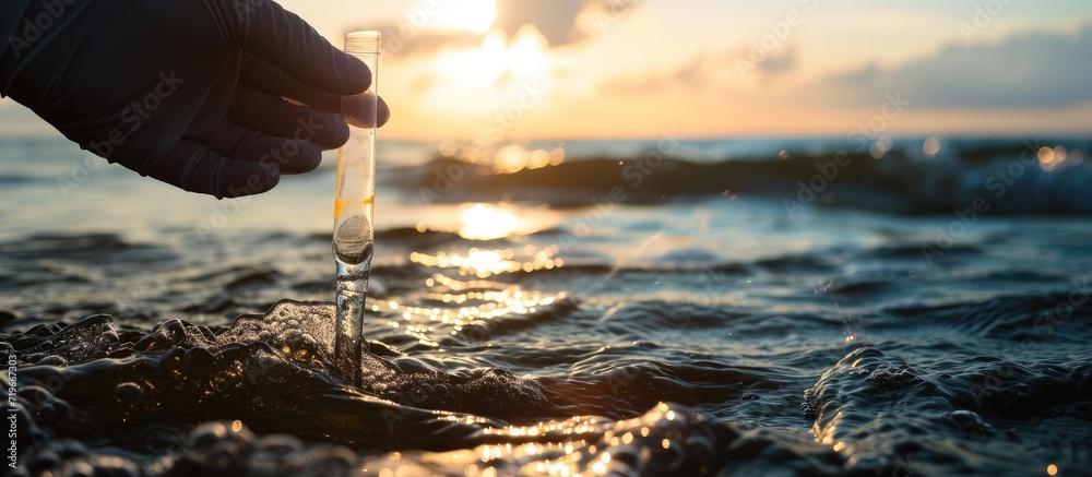 Sample water from the baltic sea for analysis Hand in white glove holding a test tube. Copy space image. Place for adding text - obrazy, fototapety, plakaty 