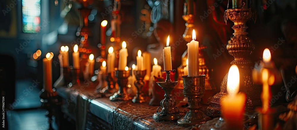 two burning candles for baptism in the orthodox church Christian faith and traditions Two burning candles in an orthodox church close up vertical orientation photo. Copy space image two burning candles for baptism in the orthodox church Christian faith and traditions Two burning candles in an orthodox church close up vertical orientation photo. Copy space image