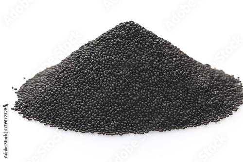 Black sesame seeds in heap, isolated on a white background, ideal for culinary and food concepts.