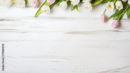 spring flowers tulips on rustic white wooden table texture top view with copy space #719684555