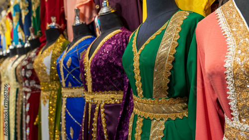 arabic women dress koftan for sale at a textile store in the souq faleh. photo