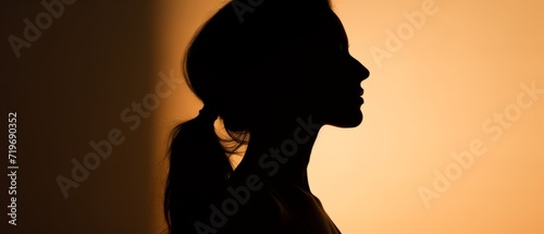 Silhouette of a girl against a sunset background