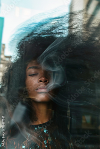 African American woman with double exposure and motion blur, psychedelic effect. Vertical shot