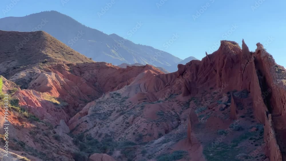A fabulous canyon in Central Asia. Scenic view of a beautiful textured multi-layered canyon. Mountain ranges in a fabulous canyon at sunset near Lake Issyk-Kul in Karakol. 4K A fabulous canyon in Central Asia. Scenic view of a beautiful textured multi-layered canyon. Mountain ranges in a fabulous canyon at sunset near Lake Issyk-Kul in Karakol. 4K