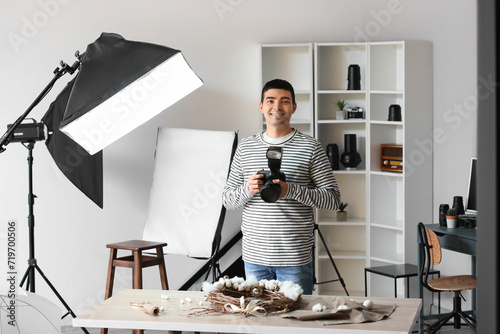 Young male photographer wit...