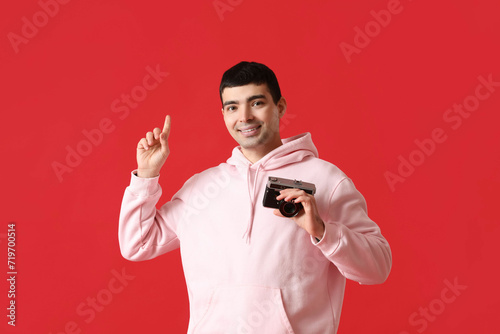 Young male photographer wit...