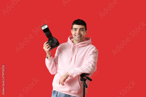 Young male photographer wit...