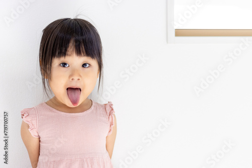 舌を出している女の子（3歳、日本人） photo