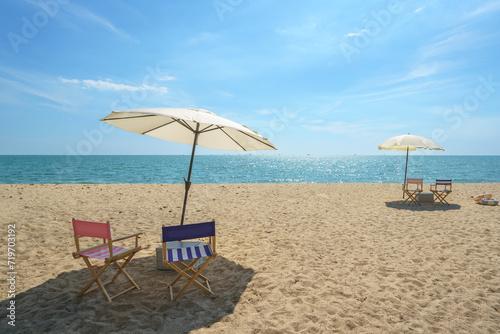 Fototapeta Naklejka Na Ścianę i Meble -  Chair and Umbrella on a Tranquil Beach