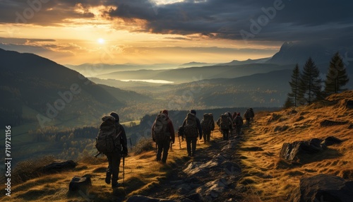 As the sun sets behind the rugged mountain landscape, a group of outdoor enthusiasts stand in awe of the breathtaking view, surrounded by towering trees and endless wilderness on their hiking adventu