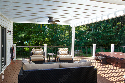 Fotografija Sunny Outdoor Deck with Pergola and Hot Tub, Suburban Retreat View