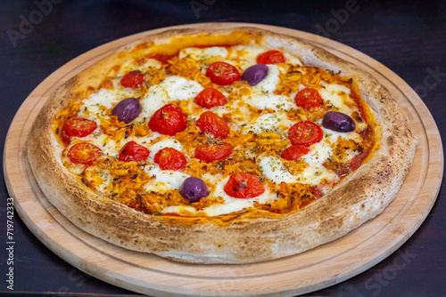 Traditional Brazilian chicken pizza with catupiry cheese, long-aged dough baked on a stone