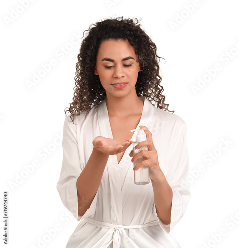 Beautiful African-American woman with hair cream on white background