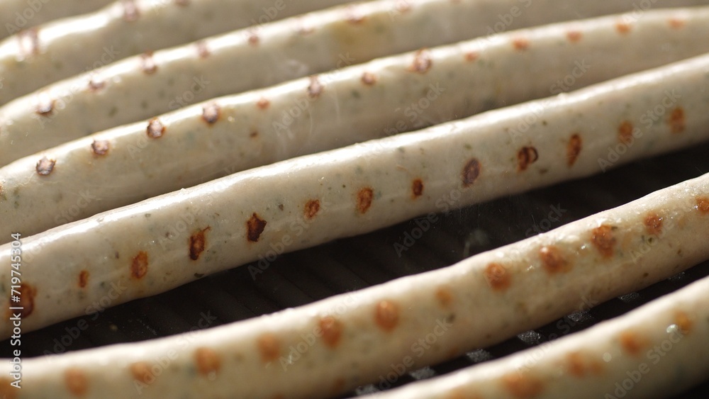 Juicy Weisswurst Sausages with Grill Marks. Selective focus, close-up. Juicy Weisswurst Sausages with Grill Marks. Selective focus, close-up.