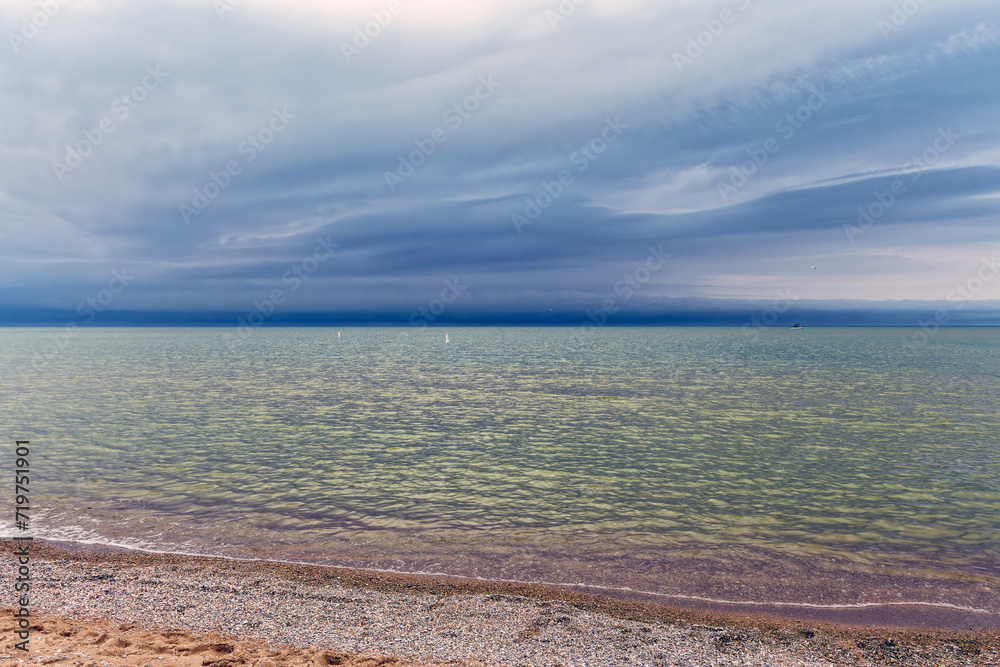 Summer storm clouds form over Grand Bend beach - Lake Huron, Ontario, Canada