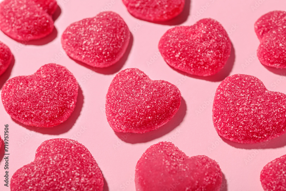 Sweet jelly candies in shape of hearts on pink background, closeup. Valentine's Day celebration Sweet jelly candies in shape of hearts on pink background, closeup. Valentine's Day celebration