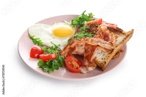 Plate with tasty fried egg, toasts, bacon, tomatoes and arugula on white background