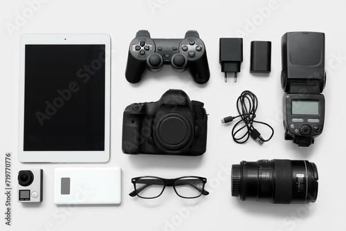 Composition with different modern gadgets on light background