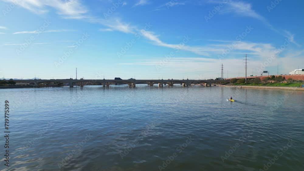 Small row boat on Tempe Town Lake located in Tempe Arizona just outside of Phoenix Small row boat on Tempe Town Lake located in Tempe Arizona just outside of Phoenix