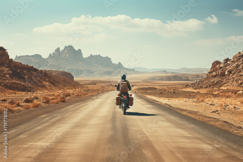 A vast desert landscape with a lone traveler on a motorcycle, evoking the spirit of adventure and the freedom of the open road. Generative Ai.
