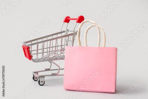 Pink shopping bag and minia...