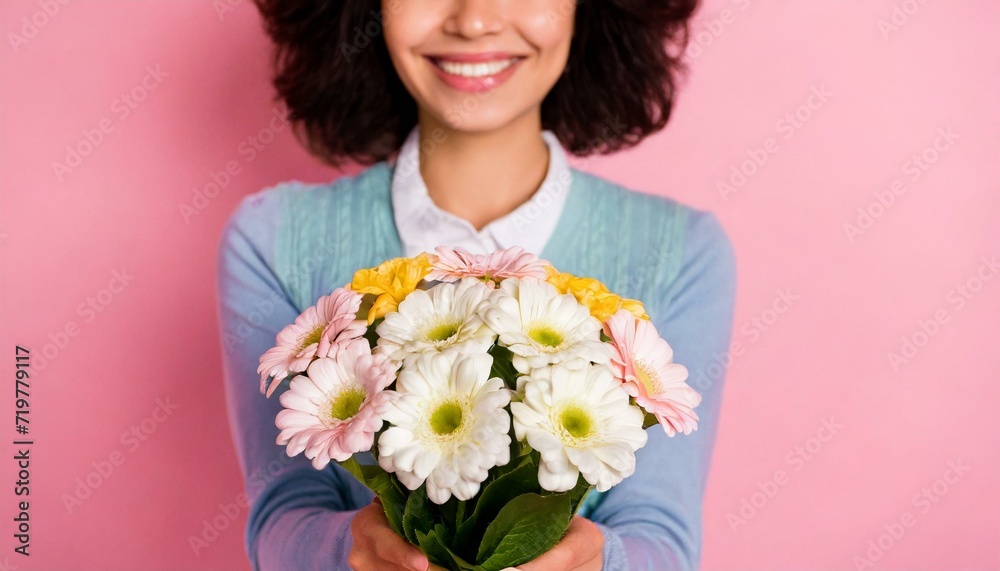 Cropped photo of charming happy young woman smile give you receive flowers isolated on pink color background Cropped photo of charming happy young woman smile give you receive flowers isolated on pink color background