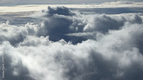 Large Cumulonimbus Clouds; Aerial View Of Mother Nature; Commercial Airplane Pilot Flying Over Severe Weather Conditions. photo