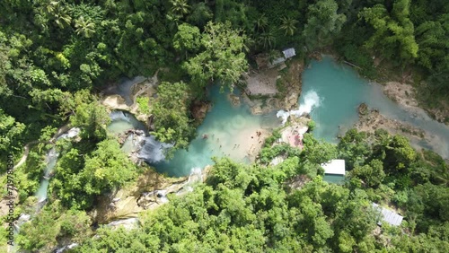 Kawasan falls and blue plunge pools in lush tropical jungle, Aerial