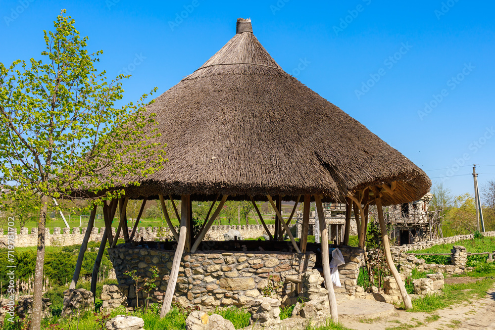 Ancient reed roof of the gazebo. Background with selective focus and copy space