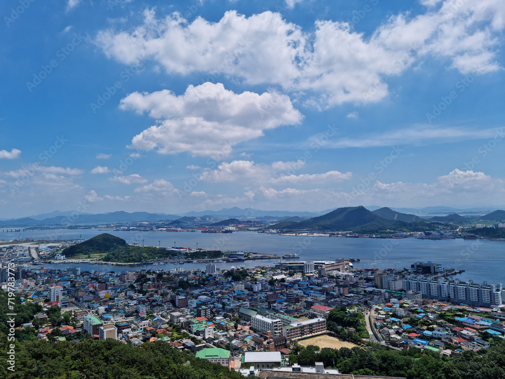 This is an aerial shot of downtown Mokpo, with the sea visible in the distance.