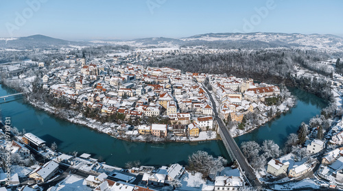 Beautiful winter cityscape with Krka river flowing in a curve around city of Novo Mesto, Slovenia