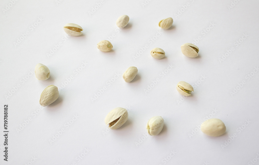 Pistachios isolated on white background, top view. Pistachios isolated on white background, top view.